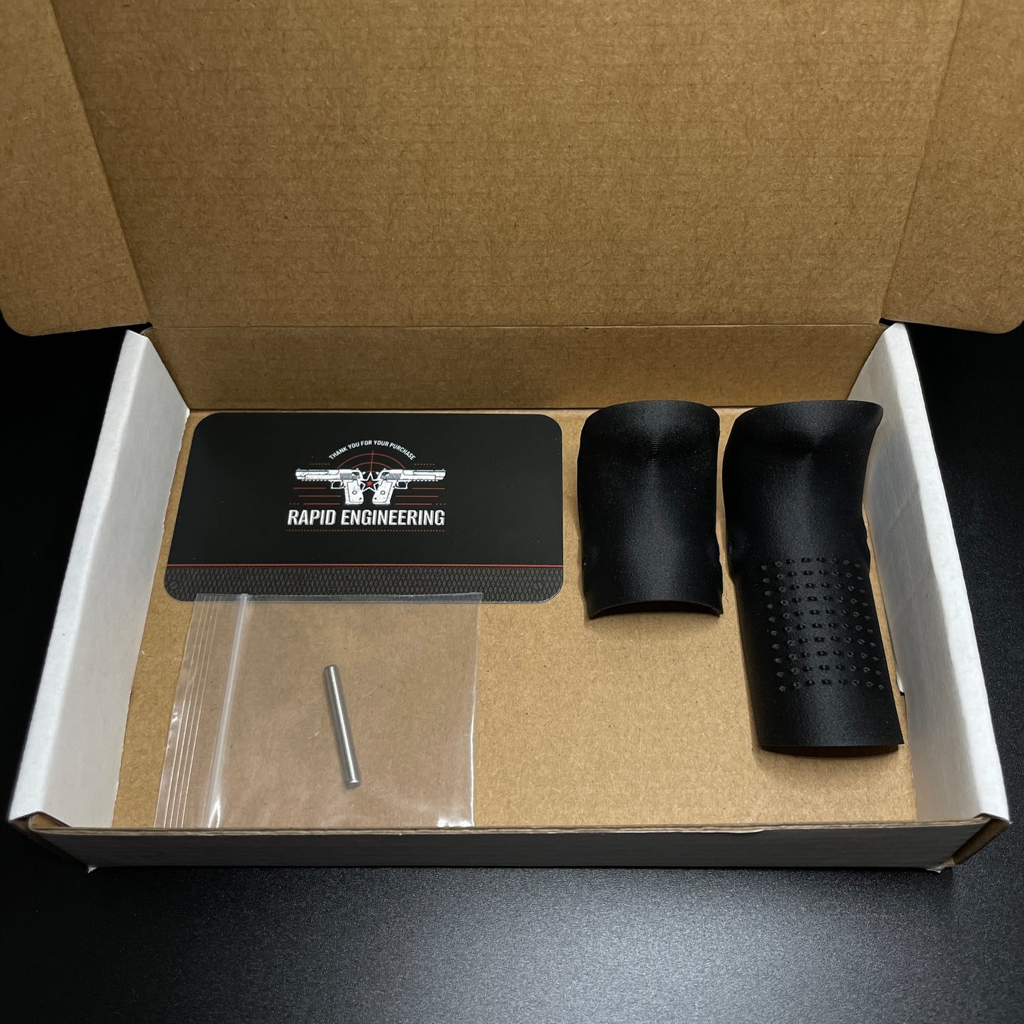 Rapid Engineering Inc. chopped backstrap beavertail grip for Glock 19, 23, 44, & 49 Gen 4 & 5, showing grips in packaging.