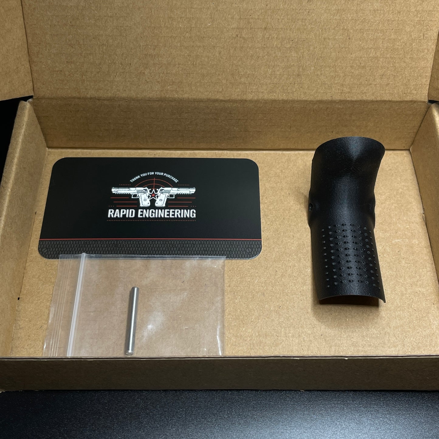 Rapid Engineering Inc. small backstrap beavertail grip for Palmetto State Armory PSA Micro Dagger, showing grip in packaging.
