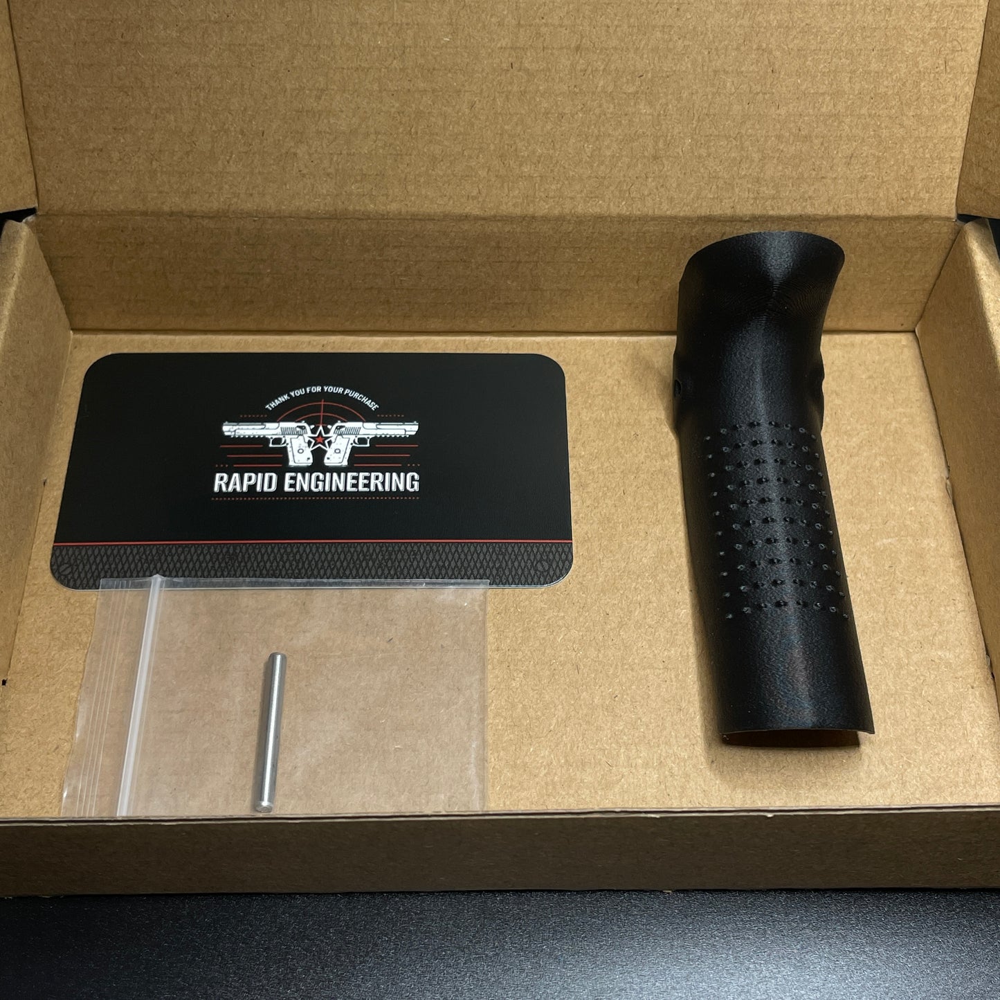 Rapid Engineering Inc. large backstrap beavertail grip for Palmetto State Armory PSA Micro Dagger, showing grip in packaging.