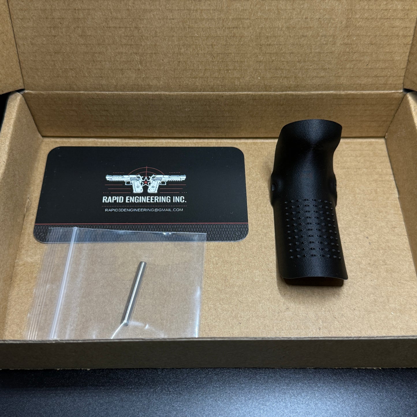 Rapid Engineering Inc. small backstrap beavertail grip for Glock 43X & 48, detailed view showing part in packaging.
