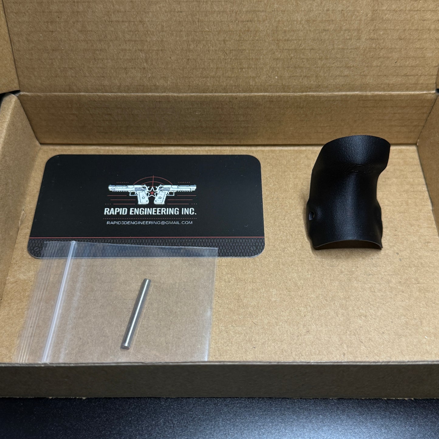 Rapid Engineering Inc. chopped backstrap beavertail grip for Glock 43X & 48, detailed view showing part in packaging.