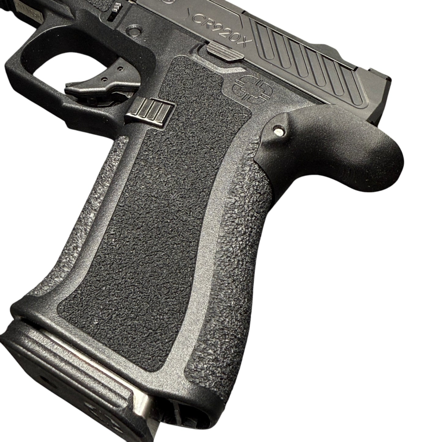 Rapid Engineering Inc. chopped backstrap beavertail grip for Shadow Systems CR920X, angled view showing improved grip angle for enhanced control.