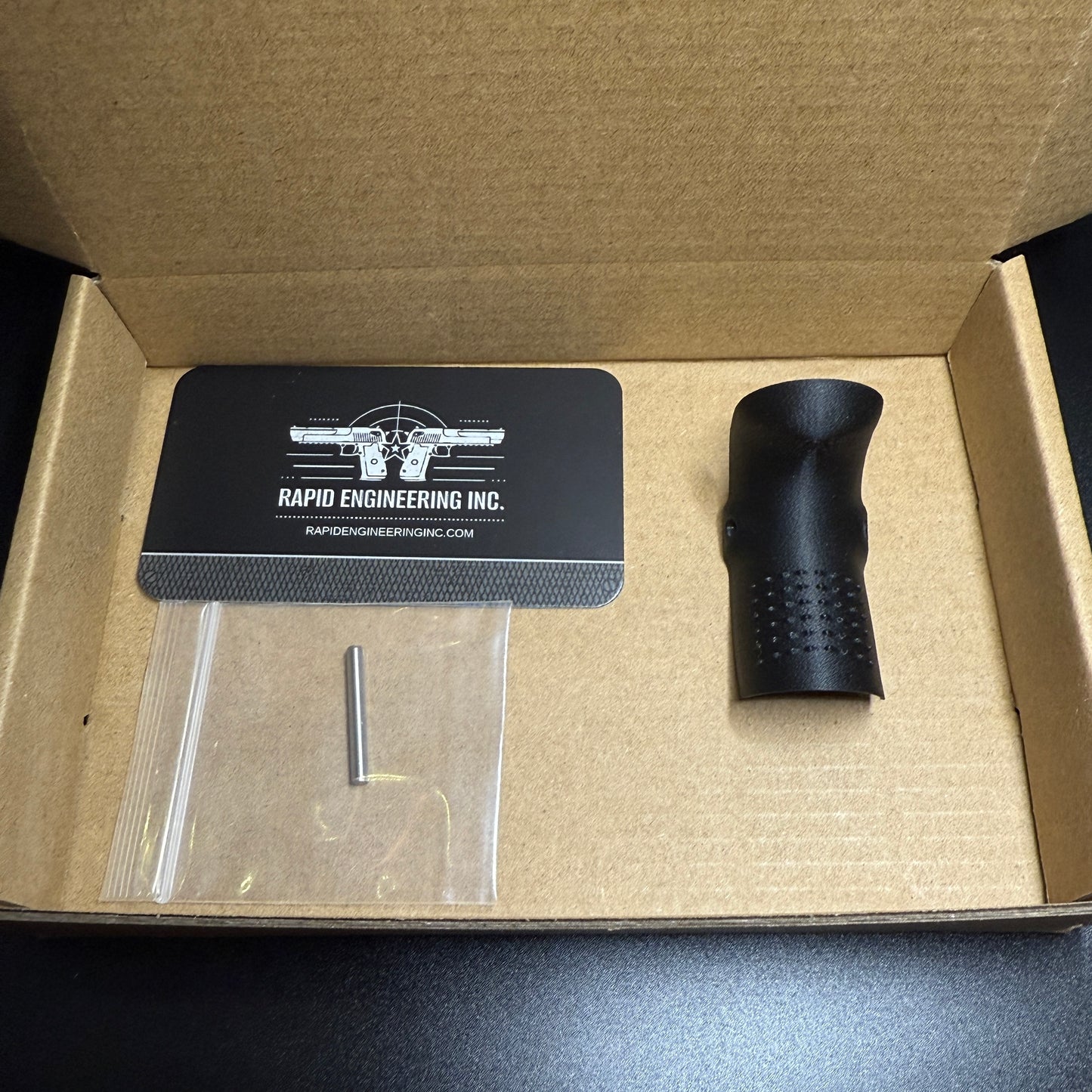 Rapid Engineering Inc. backstrap beavertail grip for Glock 43, detailed view showing part in packaging.