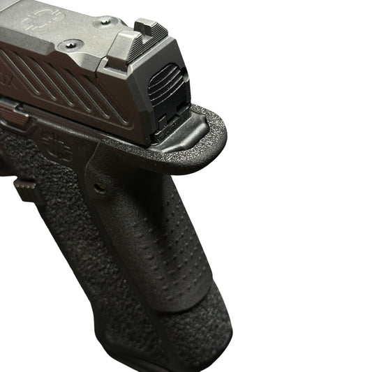 Rapid Engineering Inc. medium backstrap beavertail grip for Shadow Systems CR920X, close up angled view showing rounded beavertail