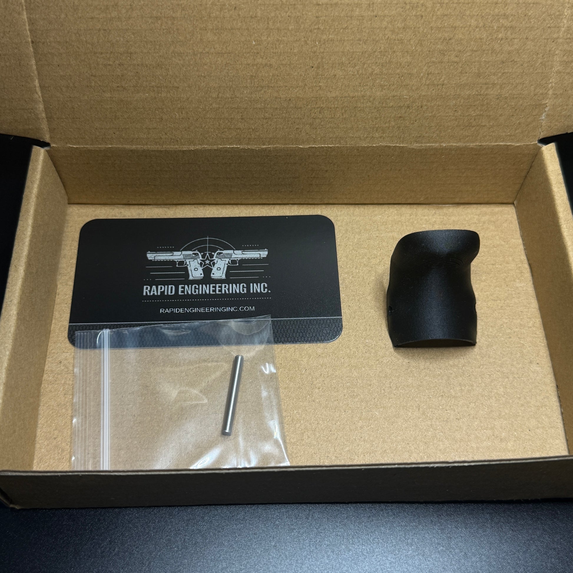 Rapid Engineering Inc. chopped backstrap beavertail grip for Glock 43X & 48, detailed view showing part in packaging.