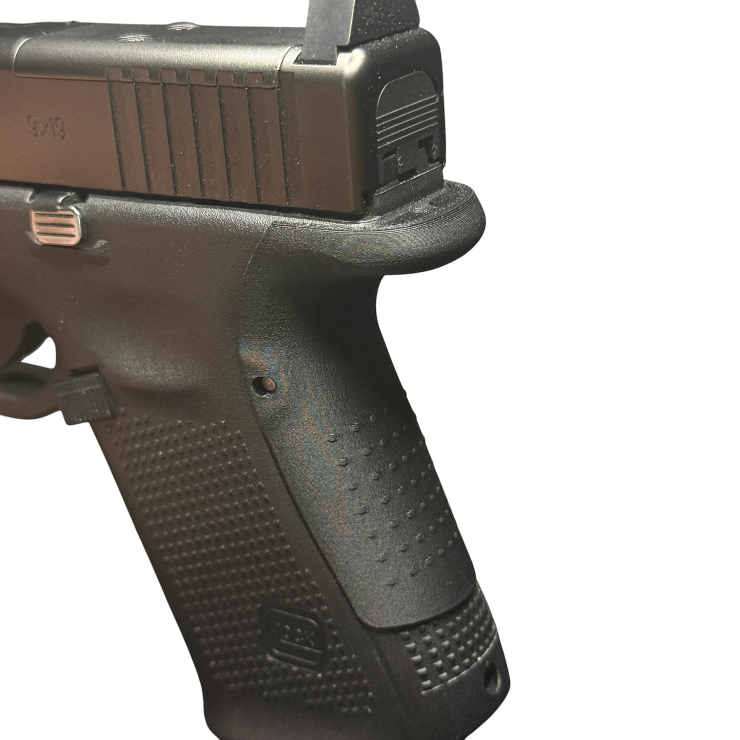 Rapid Engineering Inc. large backstrap beavertail for Glock 19, 23, 44, & 49 Gen 4 & 5, showing improved grip angle and beavertail close up angled