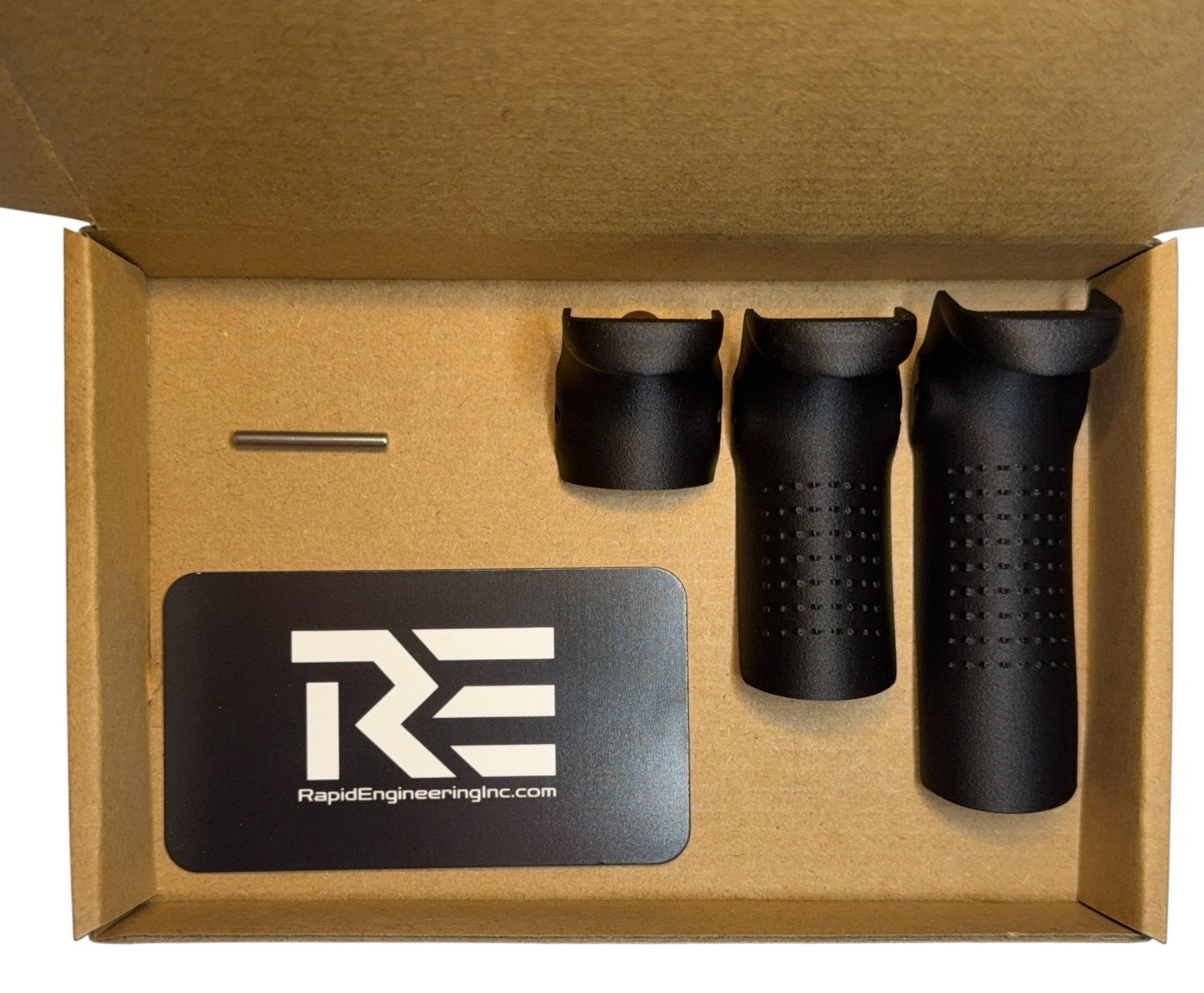 Backstrap kit contents shown in packaging: Rapid Engineering Inc. branded card, Glock 43x and 48 compatible beavertail backstrap, and installation pin arranged inside a cardboard box.