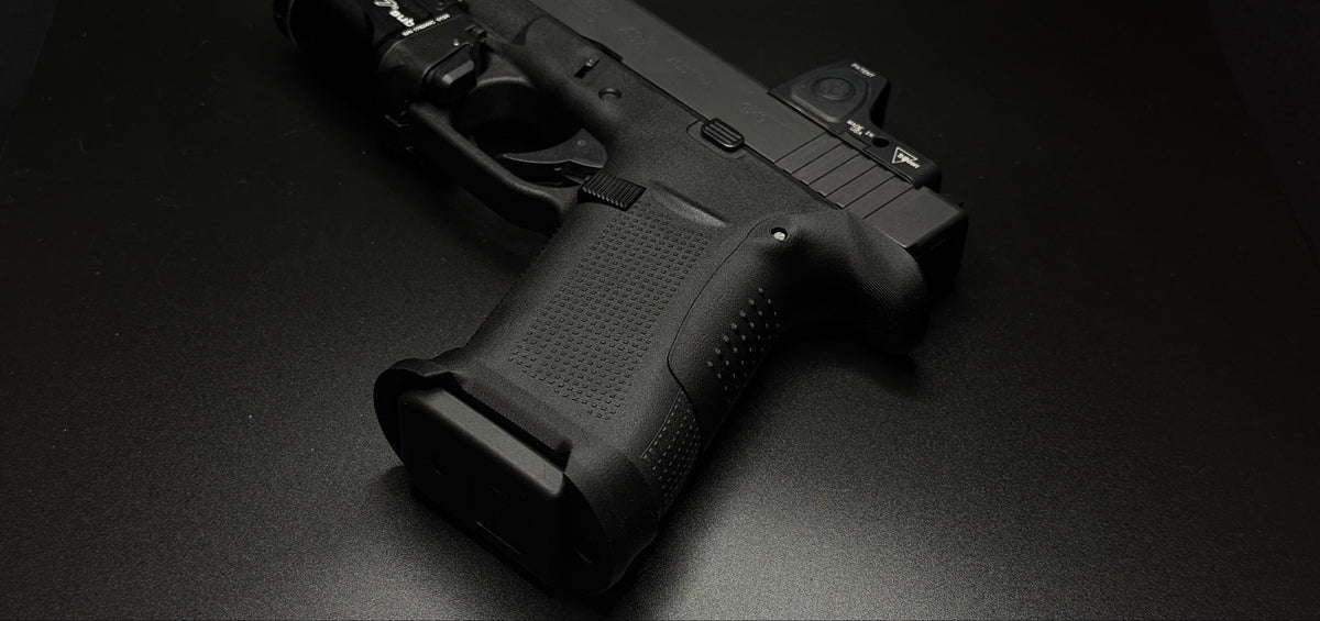 Rapid Engineering Inc. Website Banner showing magwell and 43x backstrap